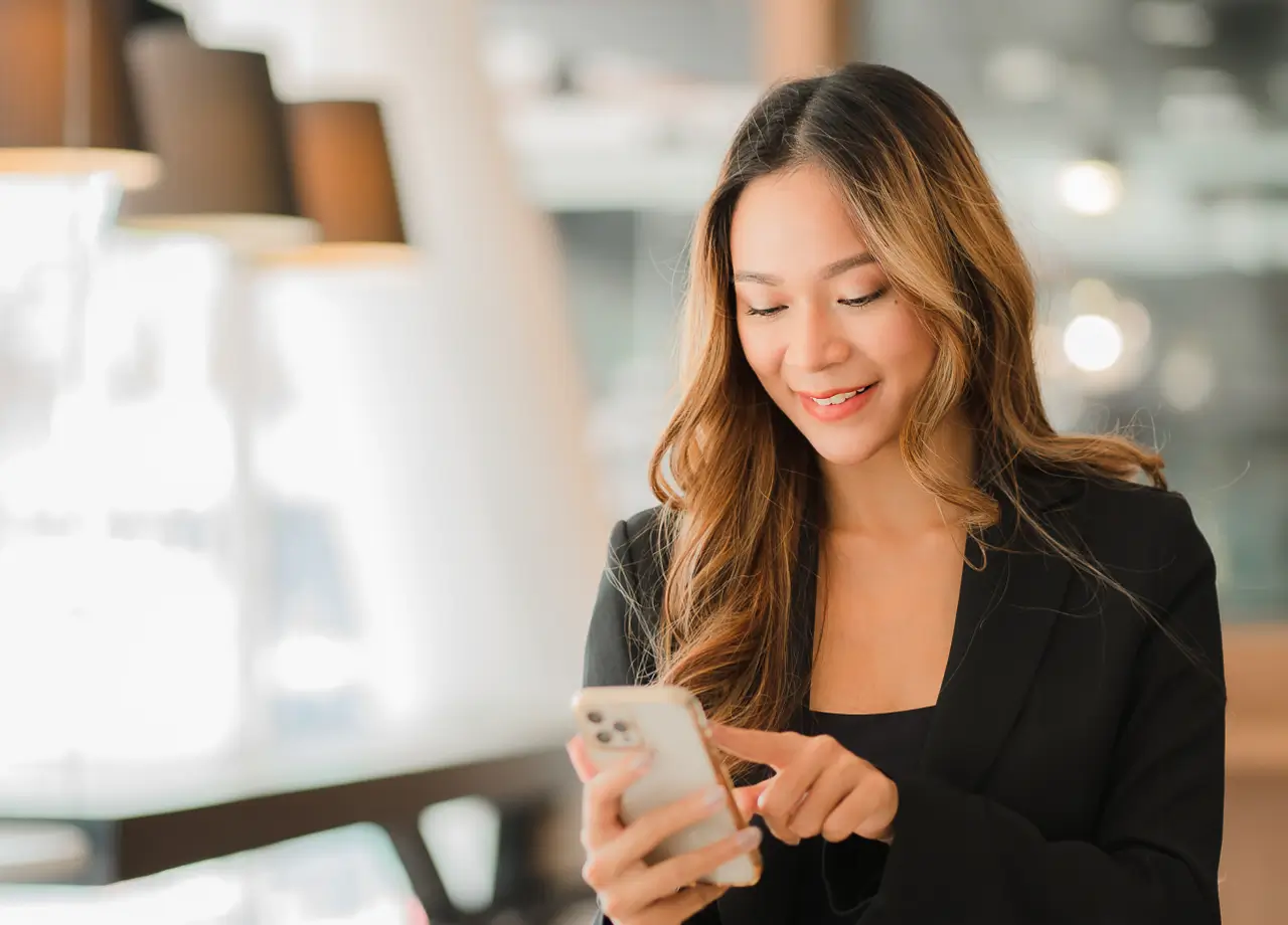 woman testing with XCUITest and Kobiton on cellphone