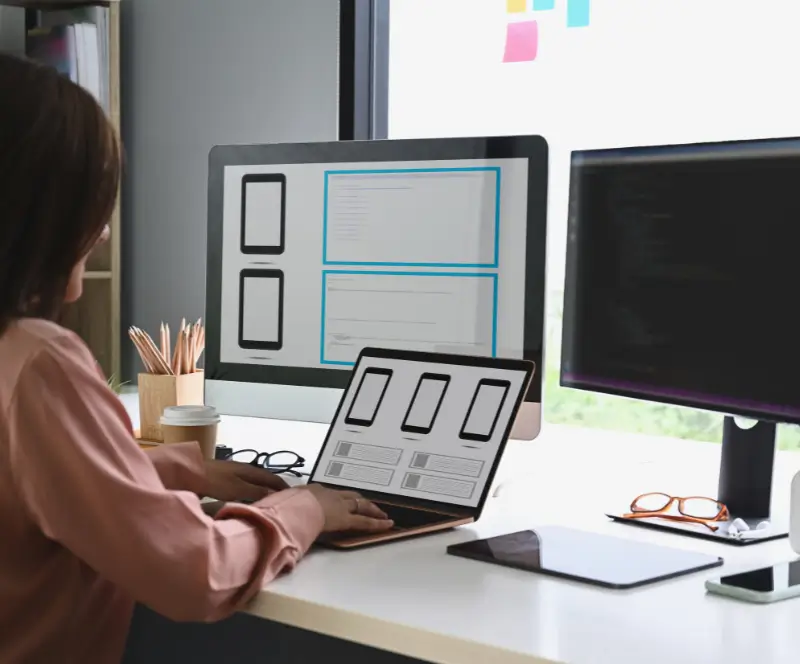 Image of a woman working at her desk