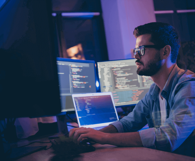 Image of man looking at computers