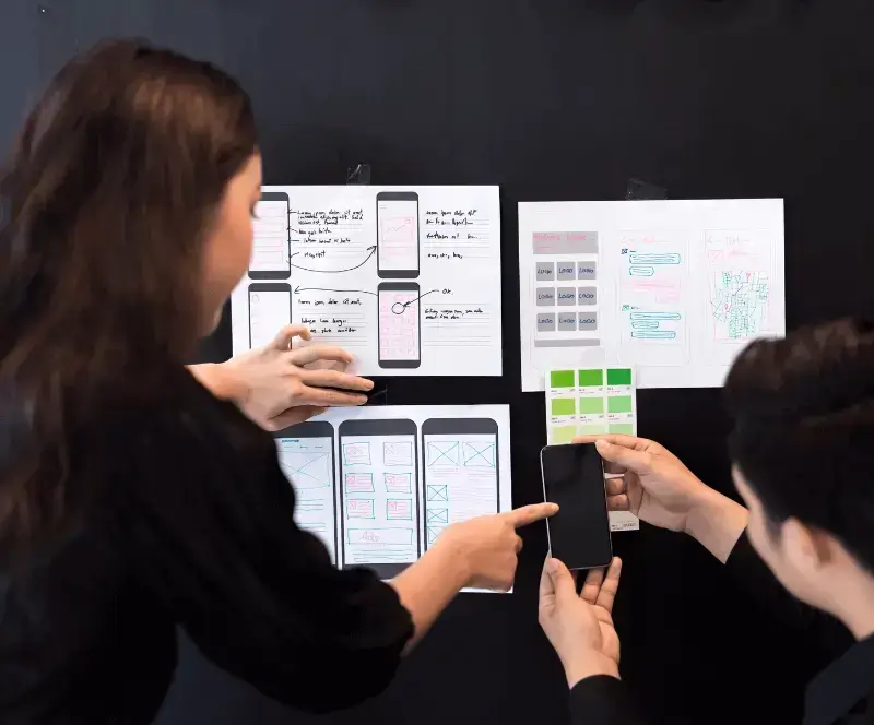 Image of two employees demonstrating Appium